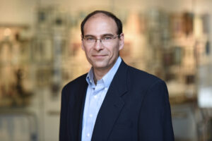 Novel Evolutionary Action Score Predicts Disease Severity from Autism Mutations